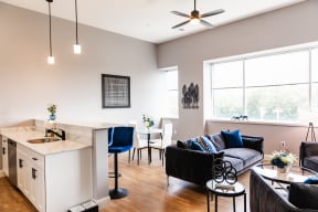 an open floor plan with a kitchen and living room