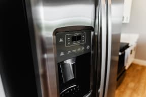 a kitchen with a refrigerator freezer next to a stove