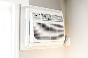 a wall mounted air conditioning unit on a wall