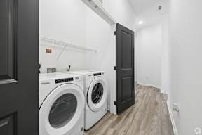 A laundry room with a washer and dryer.