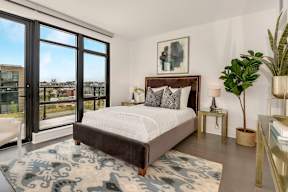 Bedroom with floor to ceiling windows