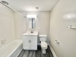 an empty bathroom with a toilet sink and tub