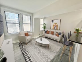 an open living room with couches and a table