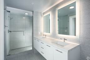 Primary Bathroom with backlit mirrors