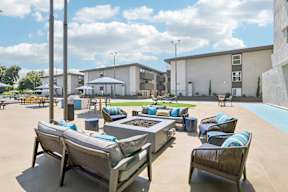 A sunny day at the outdoor seating area of a modern building.