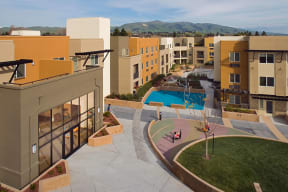 a view of the pool from the top of a building