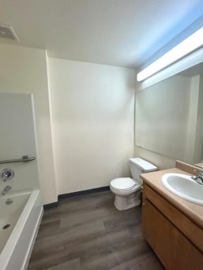 a bathroom with a sink toilet and a bath tub
