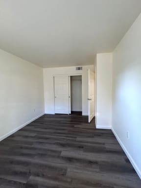 a room with white walls and a geometric design on the floor