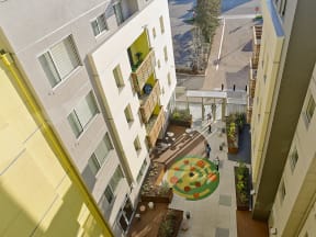 a view of the courtyard of a apartment building from above
