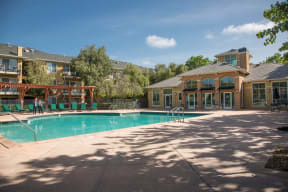 a swimming pool with a building in the background
