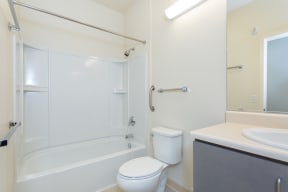 a bathroom with a shower toilet and sink
