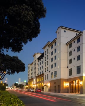 a view of the hotel from the street at night