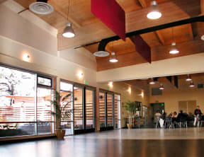 a large lobby with people sitting at tables