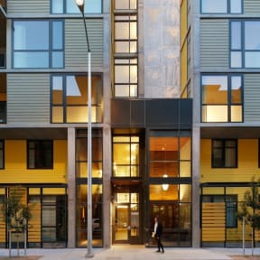 the facade of the building is lit up at night