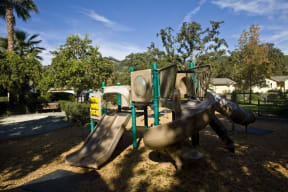 a playground with slides at a park