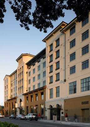 a large building with cars parked outside of it