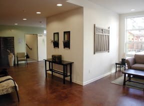 an empty living room with a couch and a table
