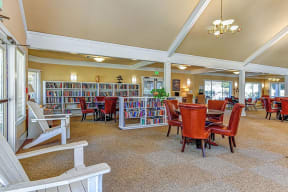 the library at the community center with tables and chairs