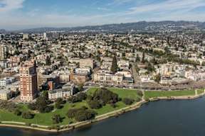 an aerial view of the city and the river