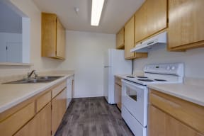 the preserve at ballantyne commons apartment kitchen with stove refrigerator and sink