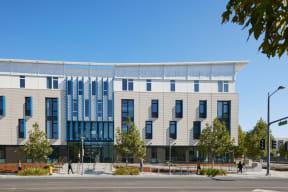 a building with blue and white facade on a city street