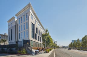 a view of the building from the corner of a street
