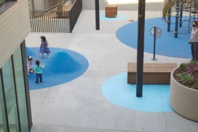 a group of children playing in a playground