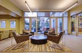 a lobby with couches and chairs and a coffee table