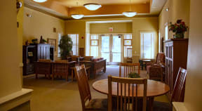 a dining room with a table and chairs