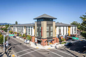 a large building on the corner of a city street