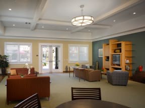 a living room with couches and chairs and a table