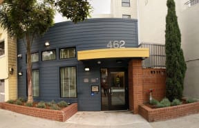the front of a building with a blue and yellow facade
