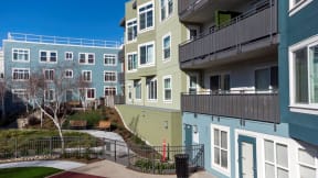 a view of a group of apartments with stairs and balconies