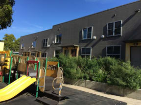 a childrens playground in front of a building