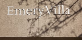a sign on the side of a building that reads emmen villa