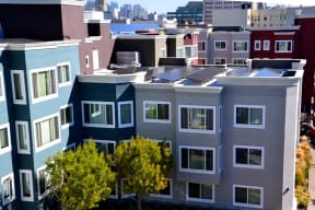 a group of buildings with solar panels on their roofs