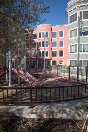 a park bench in front of an apartment building