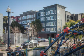 a playground in front of an apartment building