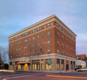 a large brick building on the corner of a street