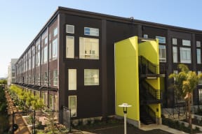 the exterior of a building with two yellow structures