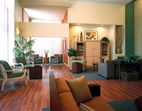a living room filled with furniture and a large window
