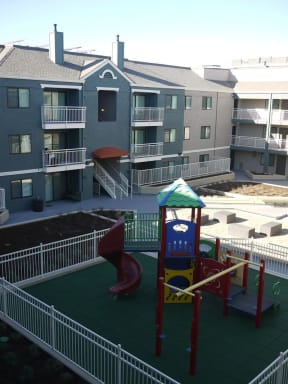 a playground in the middle of an apartment building