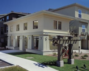 a large house with a sidewalk in front of it