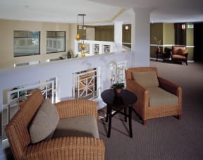 a living room with two chairs and a table
