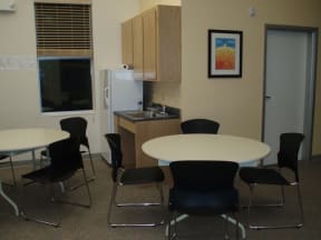 a small dining room with a table and chairs