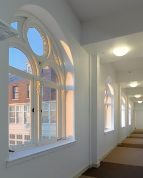 a view of the ceiling of a room with many windows