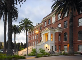 a painting of a building with palm trees