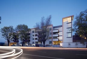 a development of apartments on a city street at night