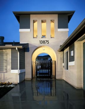 the front of a building with a gate in front of it