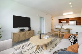 a living room with a couch and a table and a television
